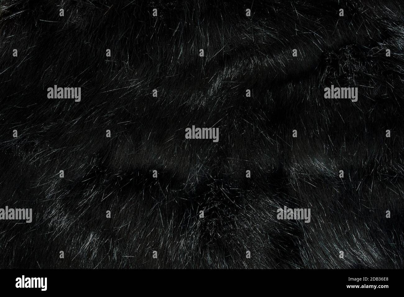 Sehr detaillierte Hintergrund Textur von schwarzen Fell aus synthetischem Tier lange Haare. Stockfoto