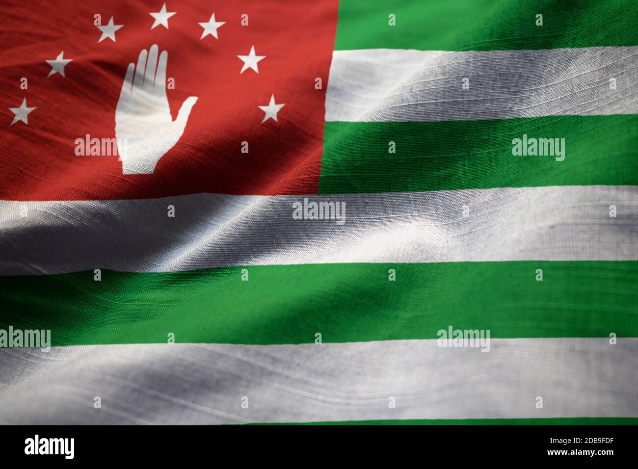 Zerzauste Fahne von Abchasien weht im Wind Stockfoto