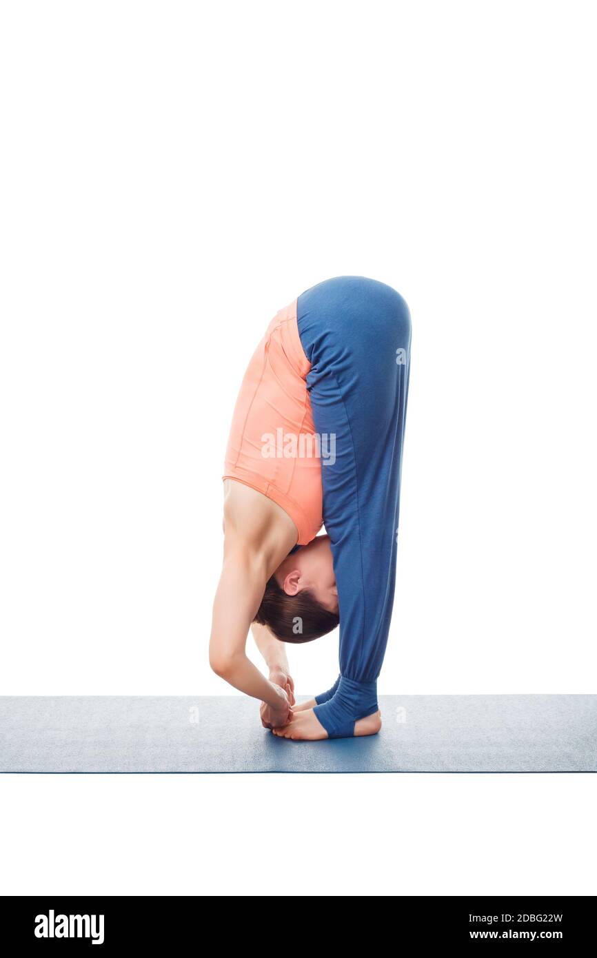 Frau, die Ashtanga Vinyasa Yoga Asana Padanguschthasana macht - vorwärts stehend Biegen Sie Hand zu Fuß Pose Haltung isoliert auf weißem Hintergrund Stockfoto