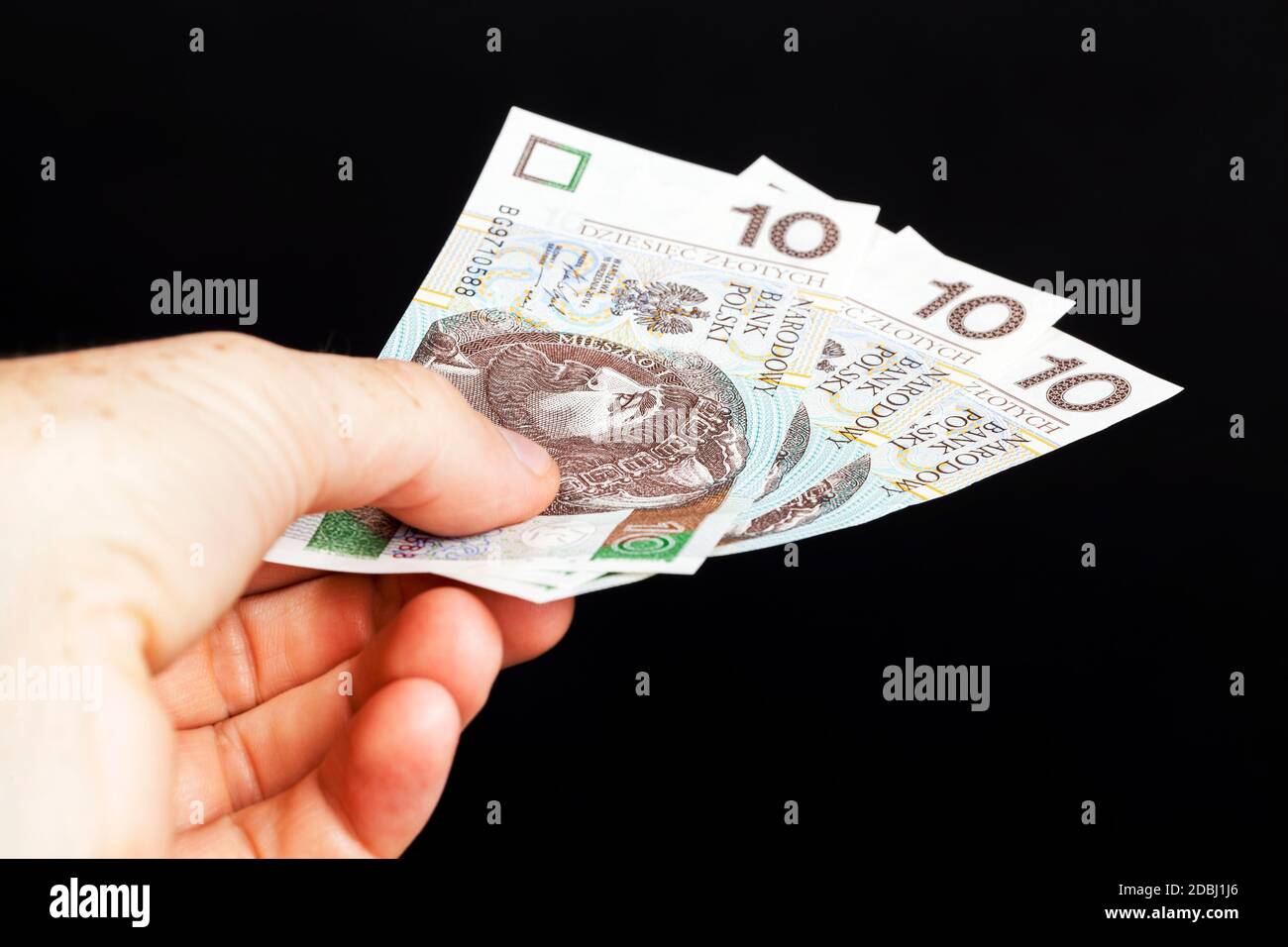 Polnisches Zloty-Geld in bar, Nahaufnahme des Geldes in einer Männerhand Stockfoto