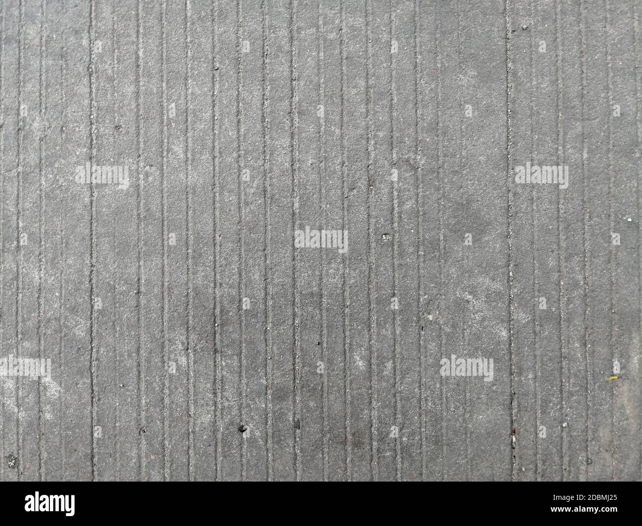 Alte gestreifte und rissige Beton Boden Textur Hintergrund. Stockfoto