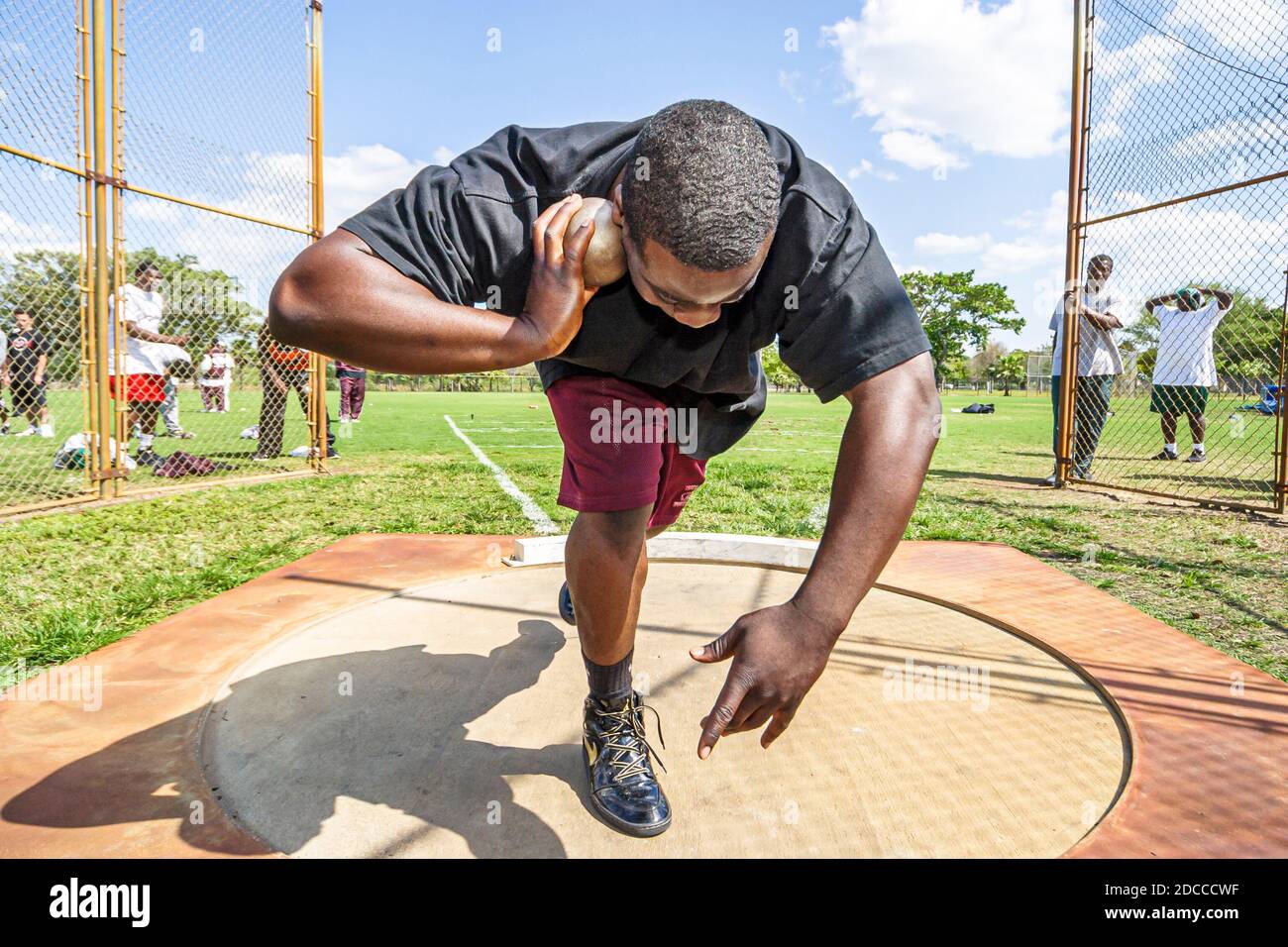 Miami Florida, Tropical Park Greater Miami Athletic Conference Championships, Track & Field High School Student students concentration, shot put competit Stockfoto