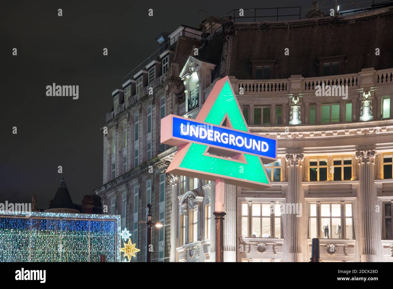 Sony Playstation 5 PS5 Launch Underground Station Entrance Sign Buttons Icons Logo Night Neon Lights in Oxford Circus, West End, London, WC1 Stockfoto