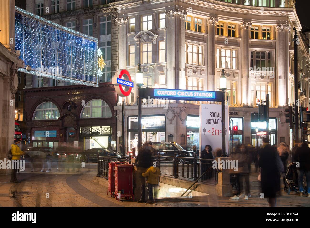 Sony Playstation 5 PS5 Launch Underground Station Entrance Sign Buttons Icons Logo Night Neon Lights in Oxford Circus, West End, London, WC1 Stockfoto