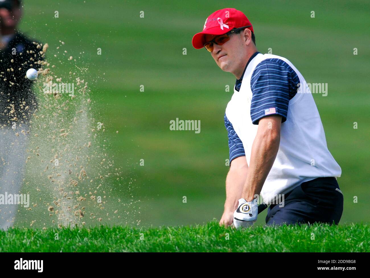 KEIN FILM, KEIN VIDEO, KEIN TV, KEINE DOKUMENTATION - US-Teammitglied Zack Johnson schlägt aus einem Bunker auf dem ersten Loch während des zweiten Tages vier-Ball-Wettbewerb im 2009 Presidents Cup auf Harding Park Golf Course in San Francisco, CA, USA am 9. Oktober 2009. Foto von Dan Honda/Contra Costa Times/MCT/Cameleon/ABACAPRESS.COM Stockfoto