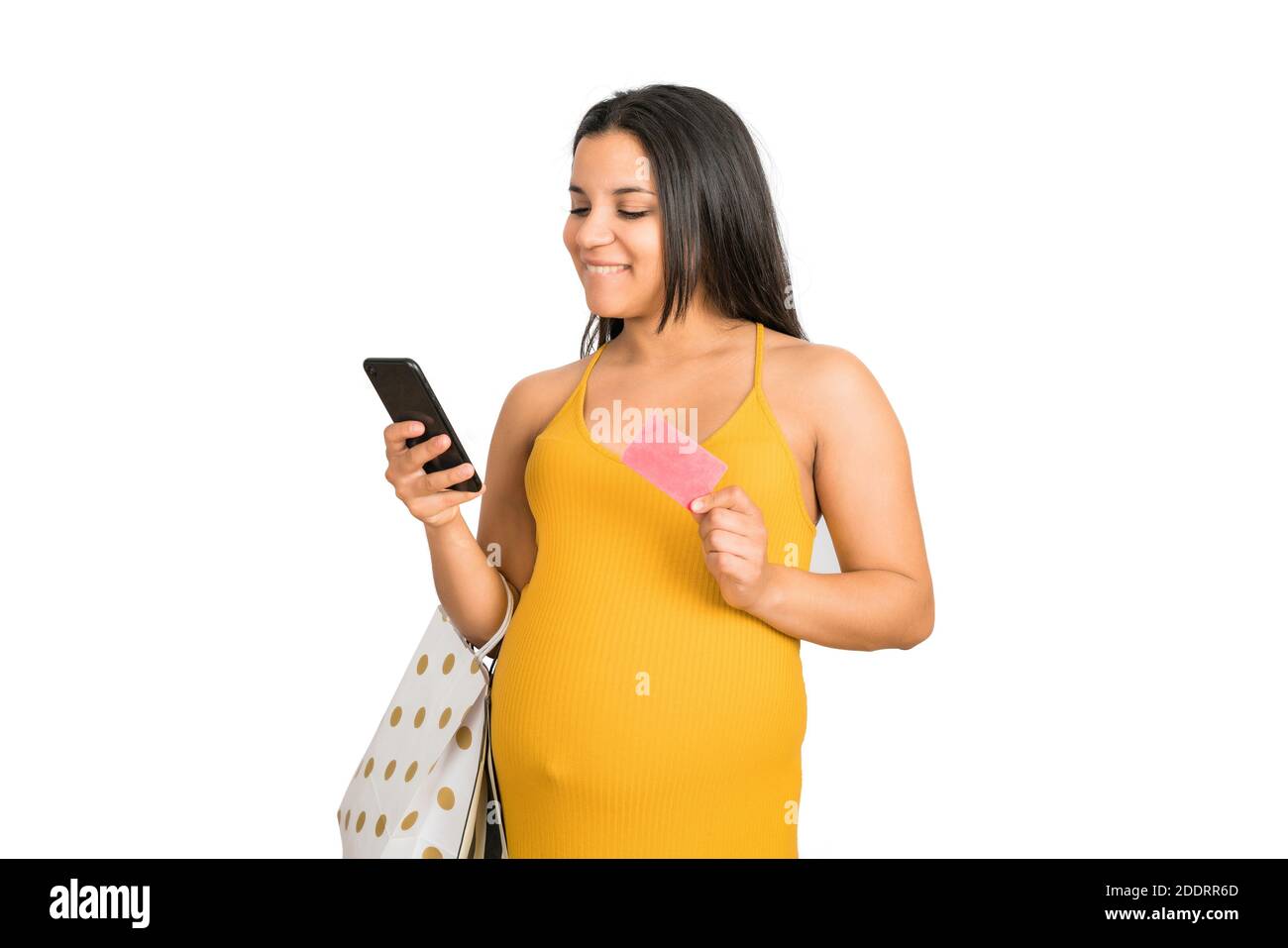 Schwangere Frau mit Kreditkarte und Telefon online einkaufen. Stockfoto