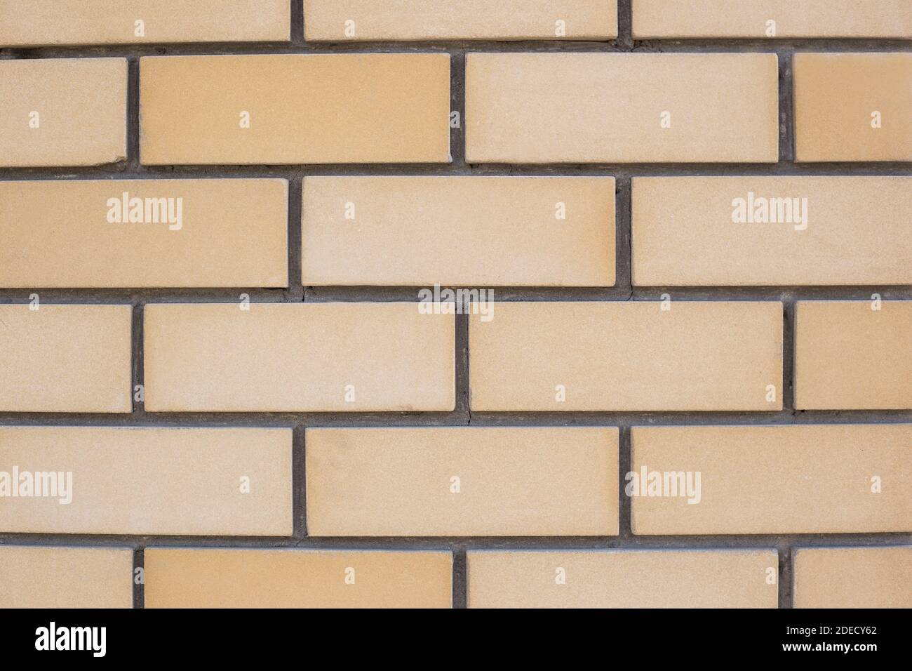 Gelbe Ziegelwand. Ziegelstruktur. Brick-Layout Stockfoto