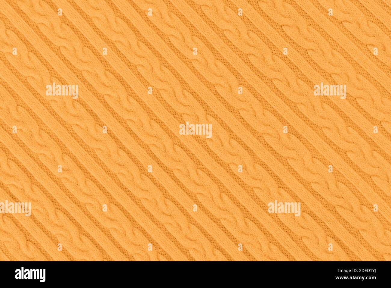 Orange diagonale Strickmode Stoff Textur Stockfoto