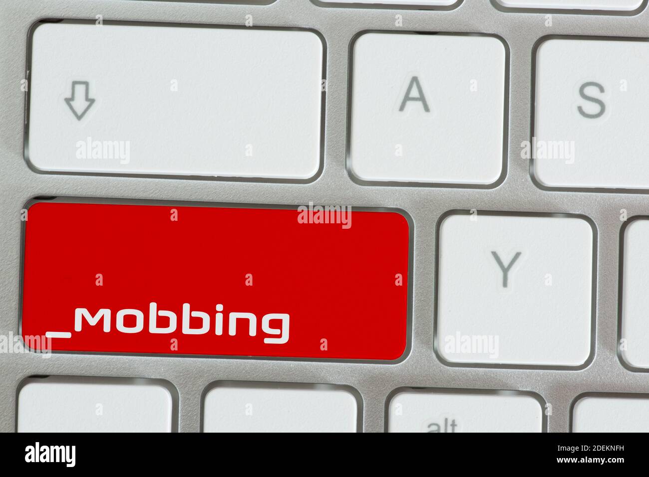 Computer und Schlüssel zum Mobbing Stockfoto