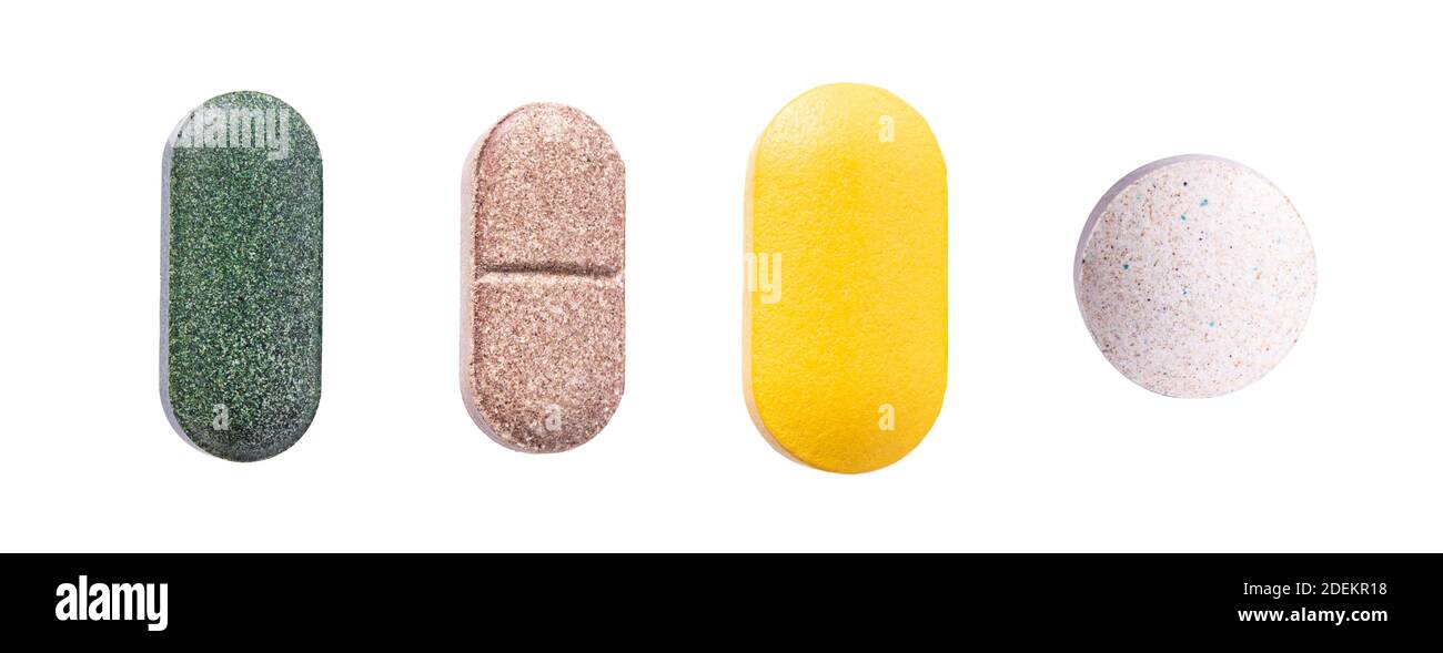 Tabletten Set von Nahrungsergänzungsmitteln, Vitaminen und Medikamenten. Ernährung Pillen, gesunde natürliche Medikamente. Vitamin C, Spirulina und Biotin Makro-Foto isoliert Stockfoto