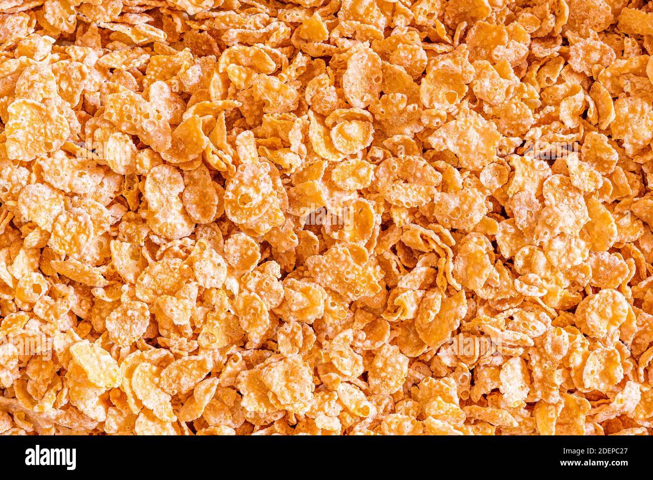 Frosted Corn Flocken Nahaufnahme Hintergrund. Ein zuckersüßes Lieblingsfrühstück. Stockfoto
