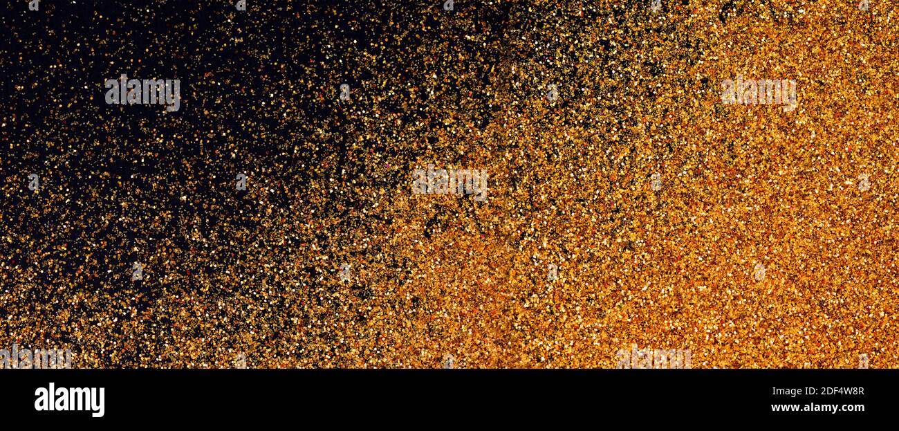 Luxus glänzend Glitter Textur Hintergrund Gold und schwarz. Goldenes Leuchten Oberfläche Gradienten Hintergrund. Farbe glitzernder Staub. Stockfoto