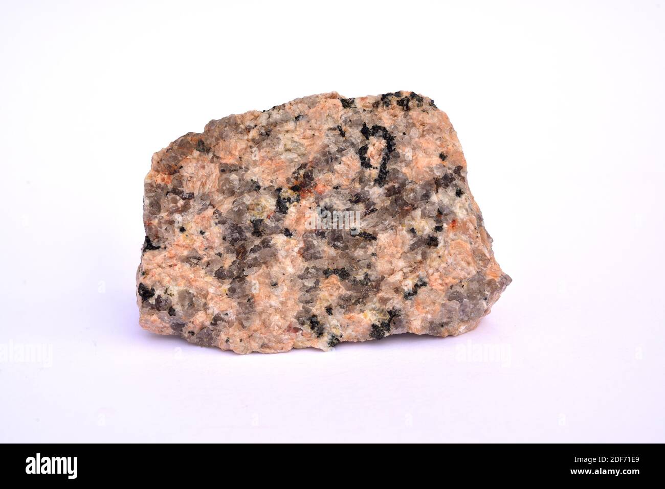 Rosafarbener Granit. Granit ist ein aufdringlicher, untränender Fels. Stockfoto