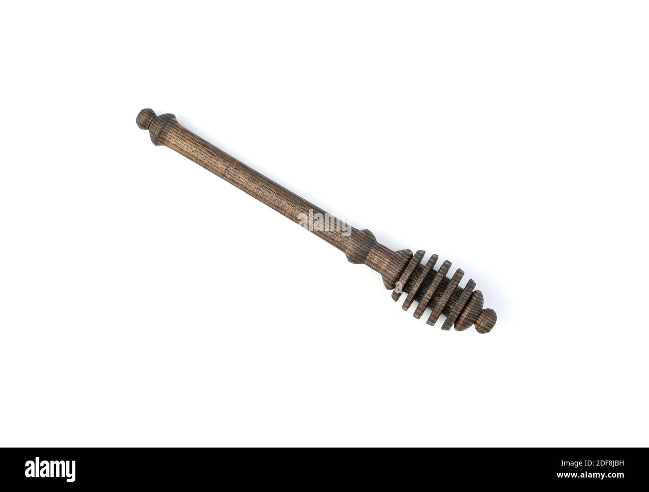 Honiglöffel aus Naturholz auf weißem Hintergrund. Stockfoto
