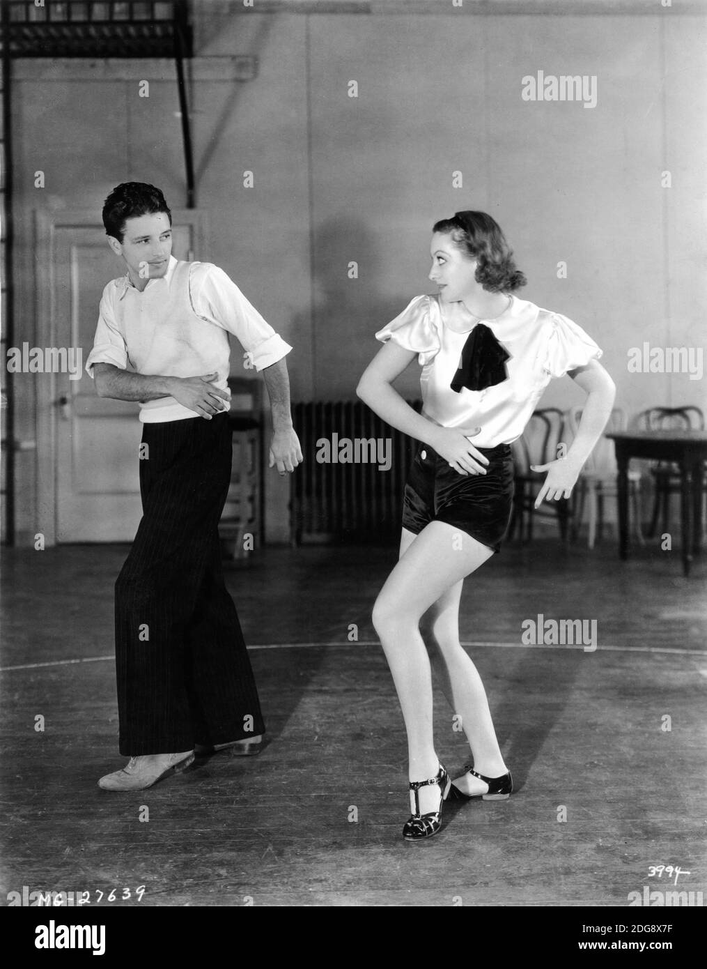 JOAN CRAWFORD nimmt Tanzunterricht mit Tanzlehrer EDDIE PRINZ für DANCING LADY 1933 Regisseur ROBERT z. LEONARD Metro Goldwyn Mayer Stockfoto