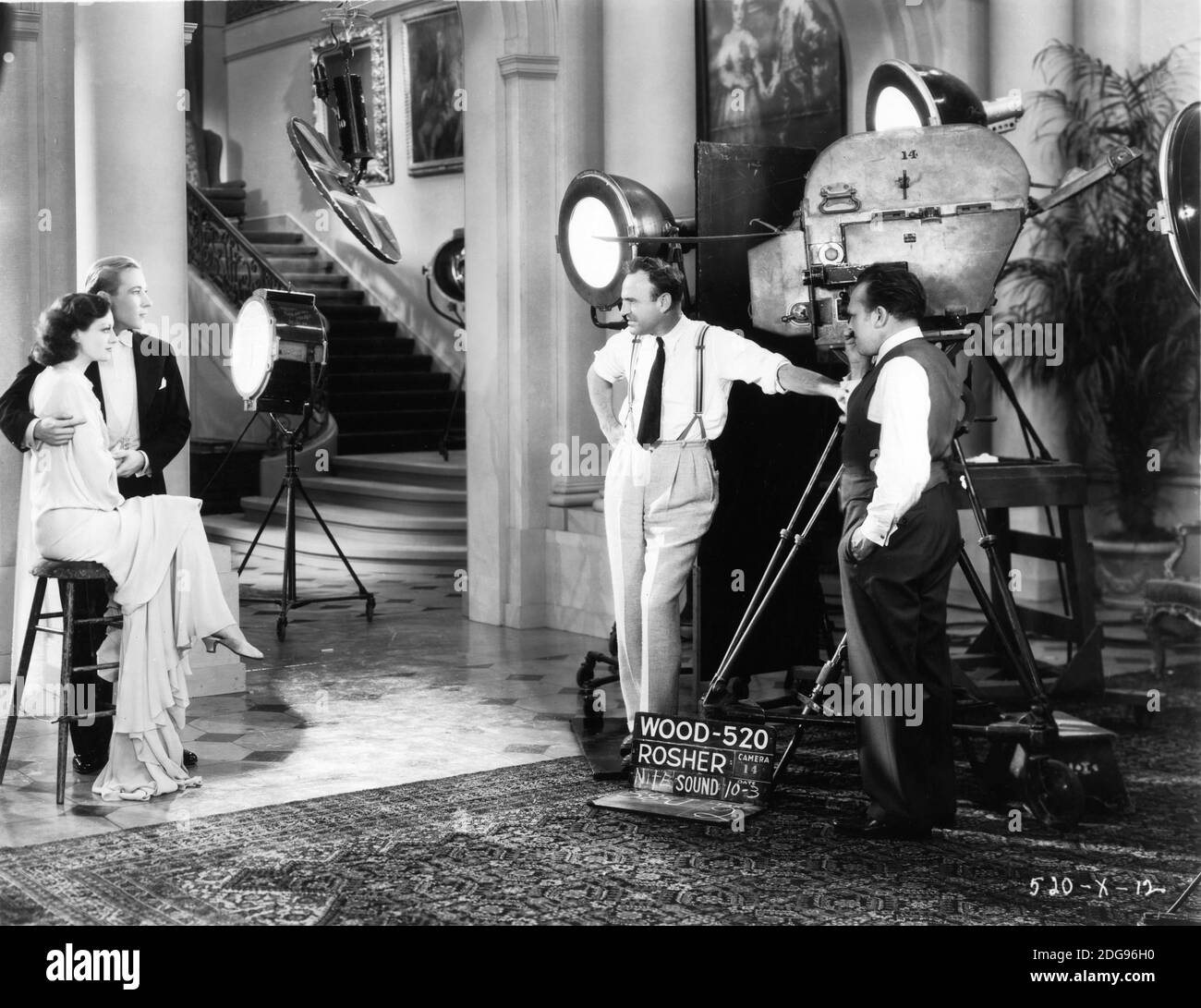 JOAN CRAWFORD und KENT DOUGLASS aka DOUGLASS MONTGOMERY am Set Offen mit Regisseur SAM WOOD und Kameramann CHARLES ROSHER während Dreharbeiten von REGISSEUR SAM WOOD Metro Goldwyn Mayer, bezahlt 1930 Stockfoto