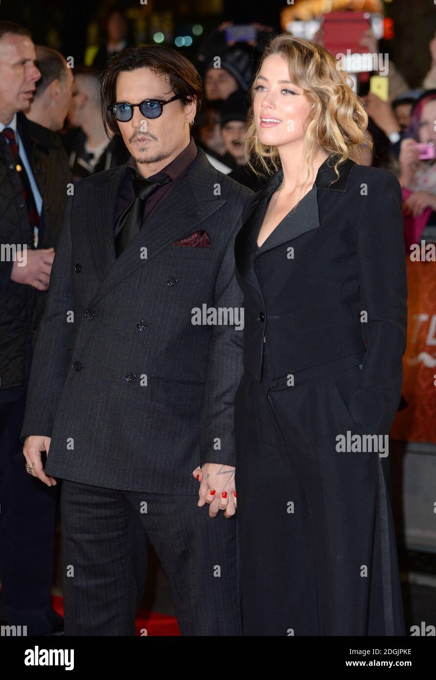 Johnny Depp und Amber hörten, wie sie bei der britischen Premiere von Mortdecai, Empire Cinema, Leicester Square, London ankamen Stockfoto