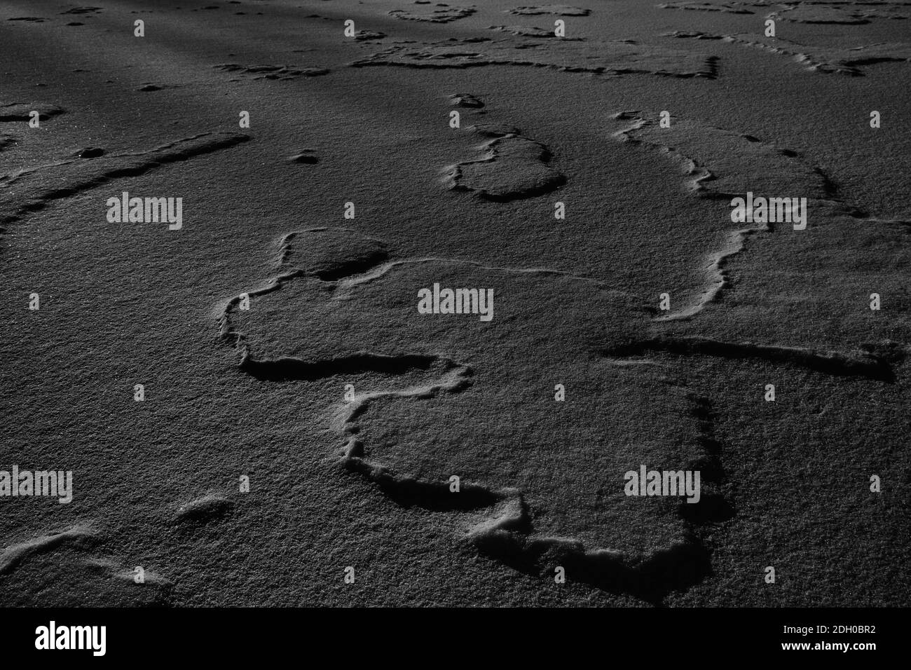 Schwarzer Sand oder Schnee Textur Hintergrund Stockfoto