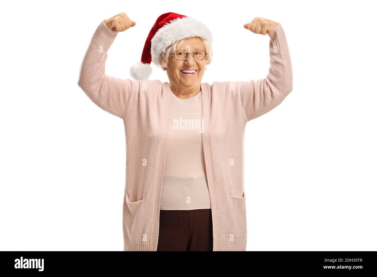 Fröhliche reife Frau zeigt Muskeln und trägt einen weihnachtsmann hat auf weißem Hintergrund isoliert Stockfoto