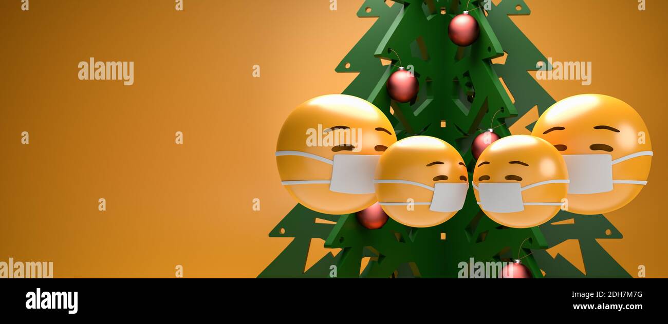 Eine Familie von vier Emoji-Gesichtern mit Gesichtsmaske vor einem weihnachtsbaum. Weihnachten in Zeiten der Corona Konzept. Größe des Webbanners. Stockfoto