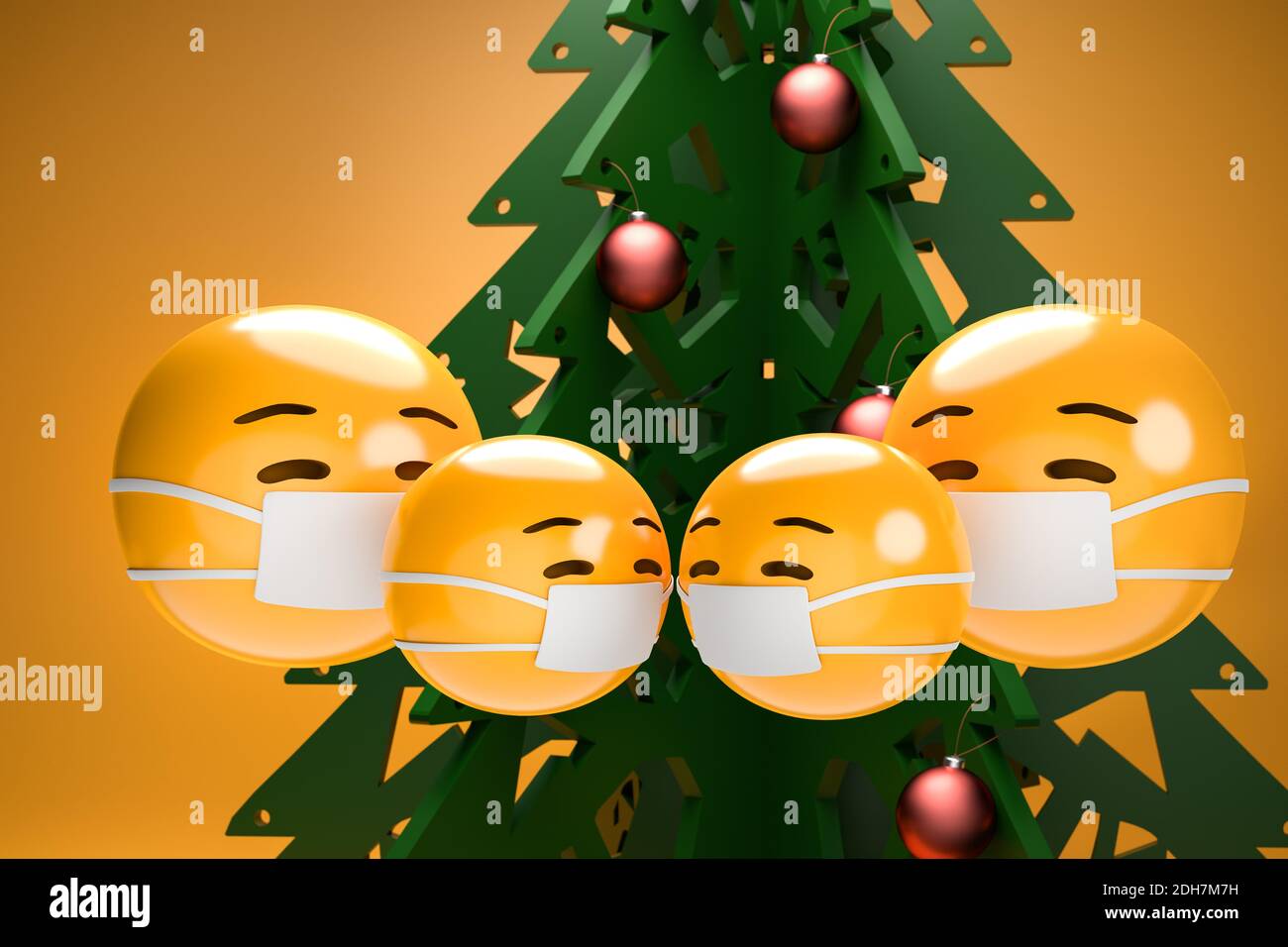 Eine Familie von vier Emoji-Gesichtern mit Gesichtsmaske vor einem weihnachtsbaum. Weihnachten in Zeiten der Corona Konzept Stockfoto