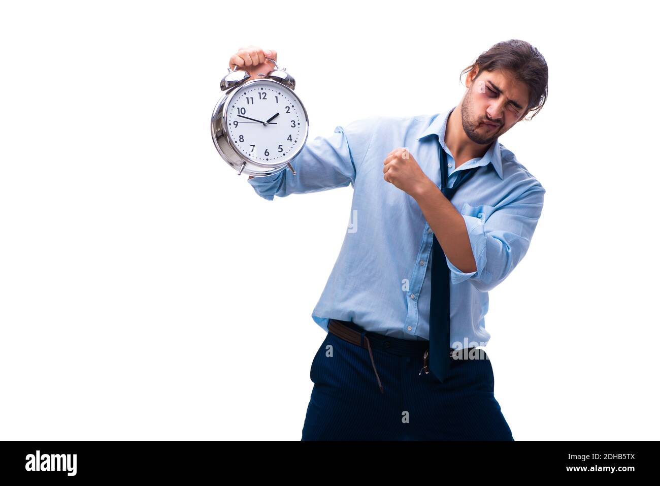 Unglücklicher junger männlicher Mitarbeiter im Zeitmanagement-Konzept Stockfoto