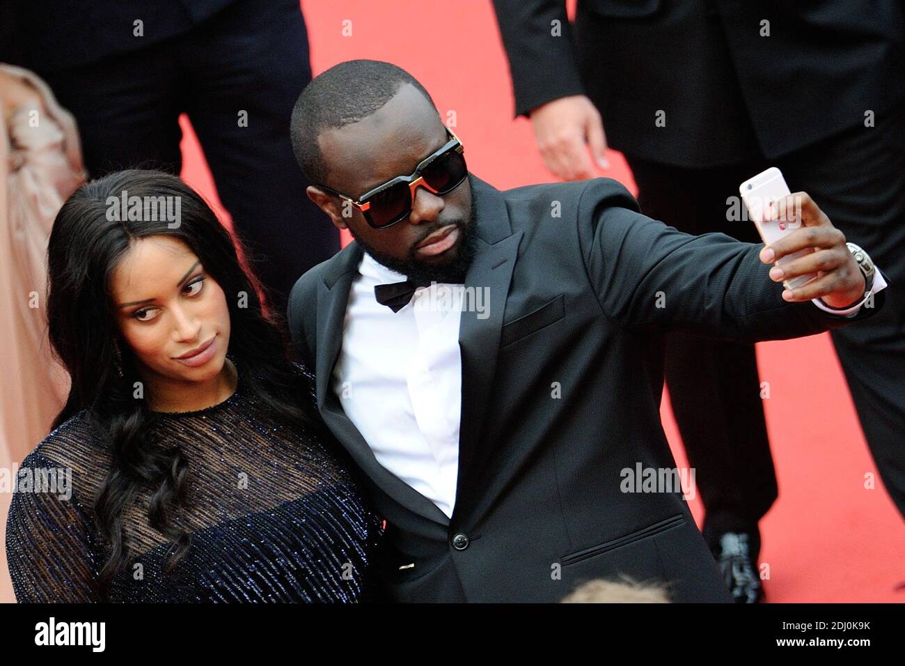 Maitre Gims und seine Freundin waren am 14. Mai 2016 im Rahmen der 69. Filmfestspiele von Cannes bei der "BFG"-Vorführung im Palais des Festivals in Cannes, Frankreich, dabei. Foto von Aurore Marechal/ABACAPRESS.COM Stockfoto