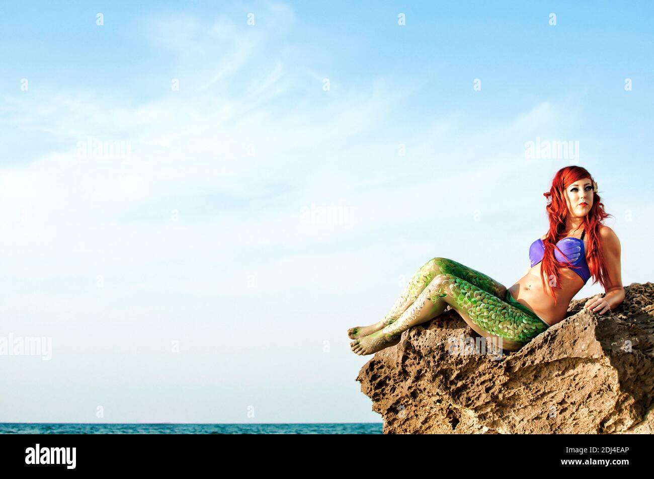 Meerjungfrau am Strand Stockfoto