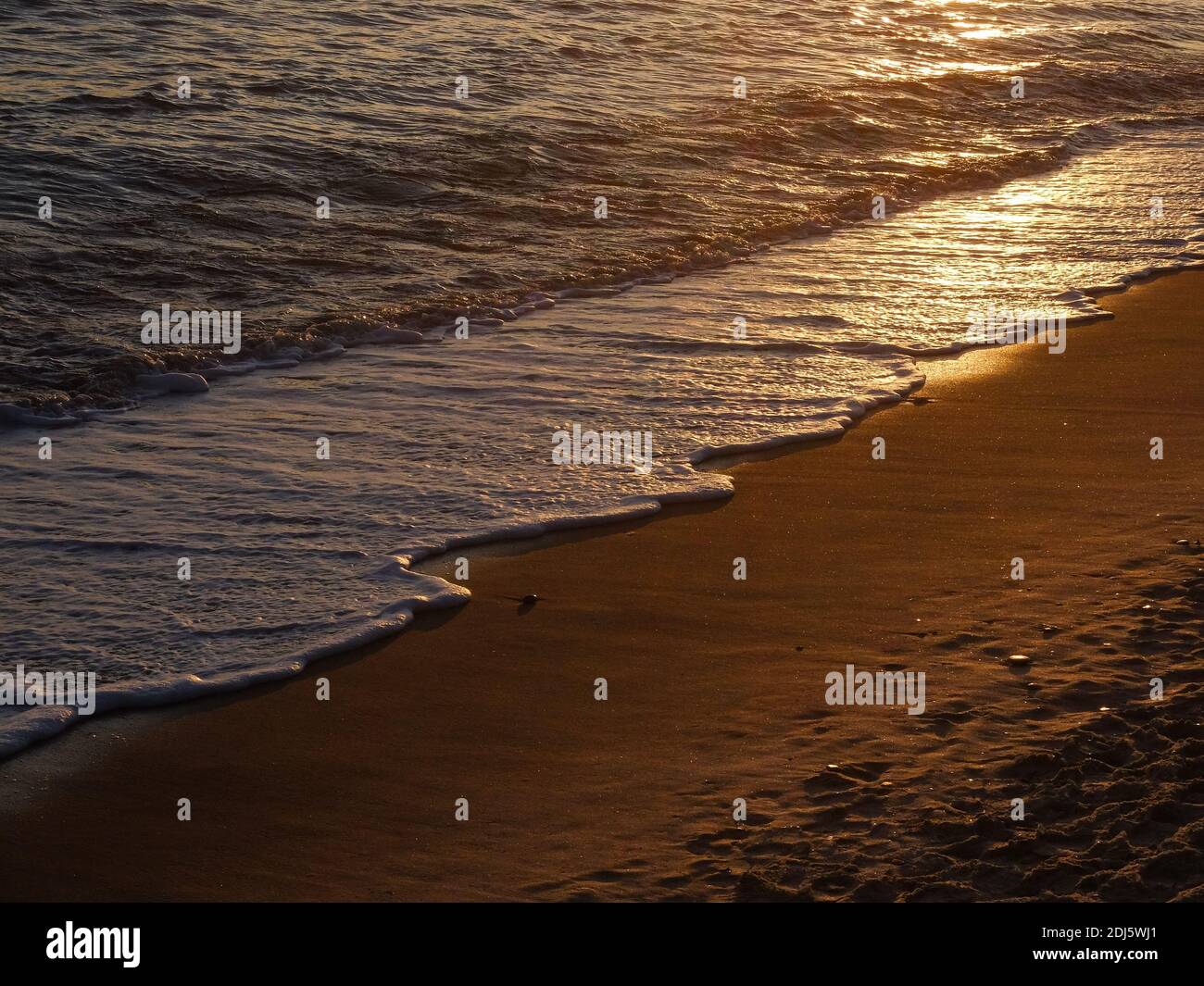 Sonnenuntergang am Strand Stockfoto