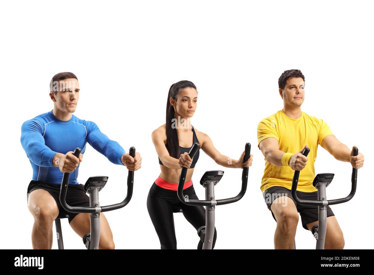 Junge Leute auf einer Spinning-Klasse trainieren auf stationären Fahrrädern Isoliert auf weißem Hintergrund Stockfoto