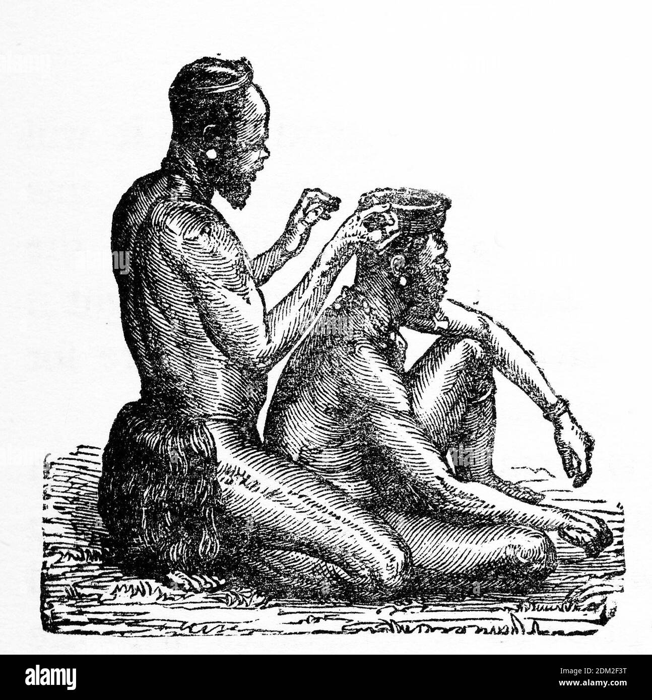 Gravur eines männlichen Afrikaners, der einen aufwendigen Kopf macht Haare für seinen Freund Stockfoto