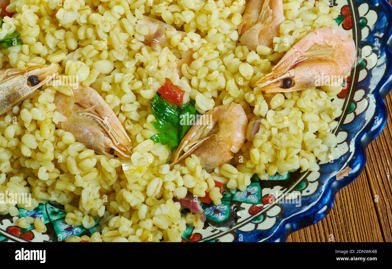 Bulgur di Pesce - Italienischer Bulgur mit Venusmuscheln Stockfoto