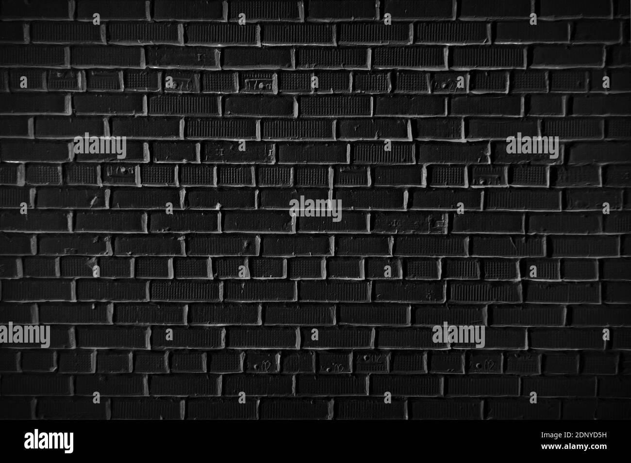 Schwarze Ziegelwand für Textur oder Hintergrund Stockfoto