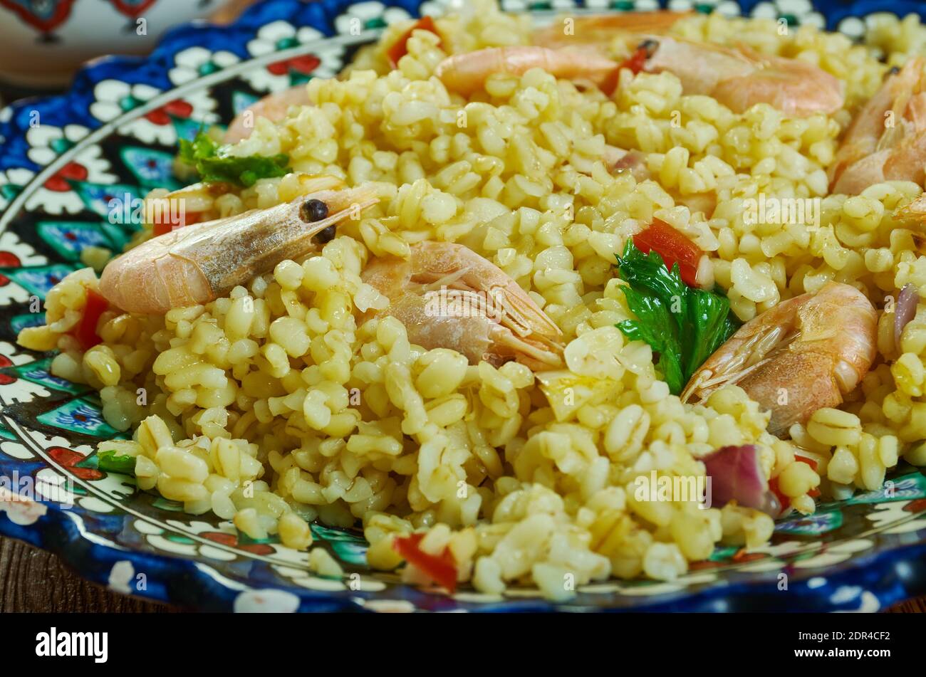 Bulgur di Pesce - Italienischer Bulgur mit Venusmuscheln Stockfoto