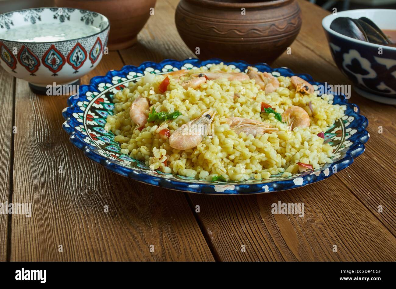 Bulgur di Pesce - Italienischer Bulgur mit Venusmuscheln Stockfoto