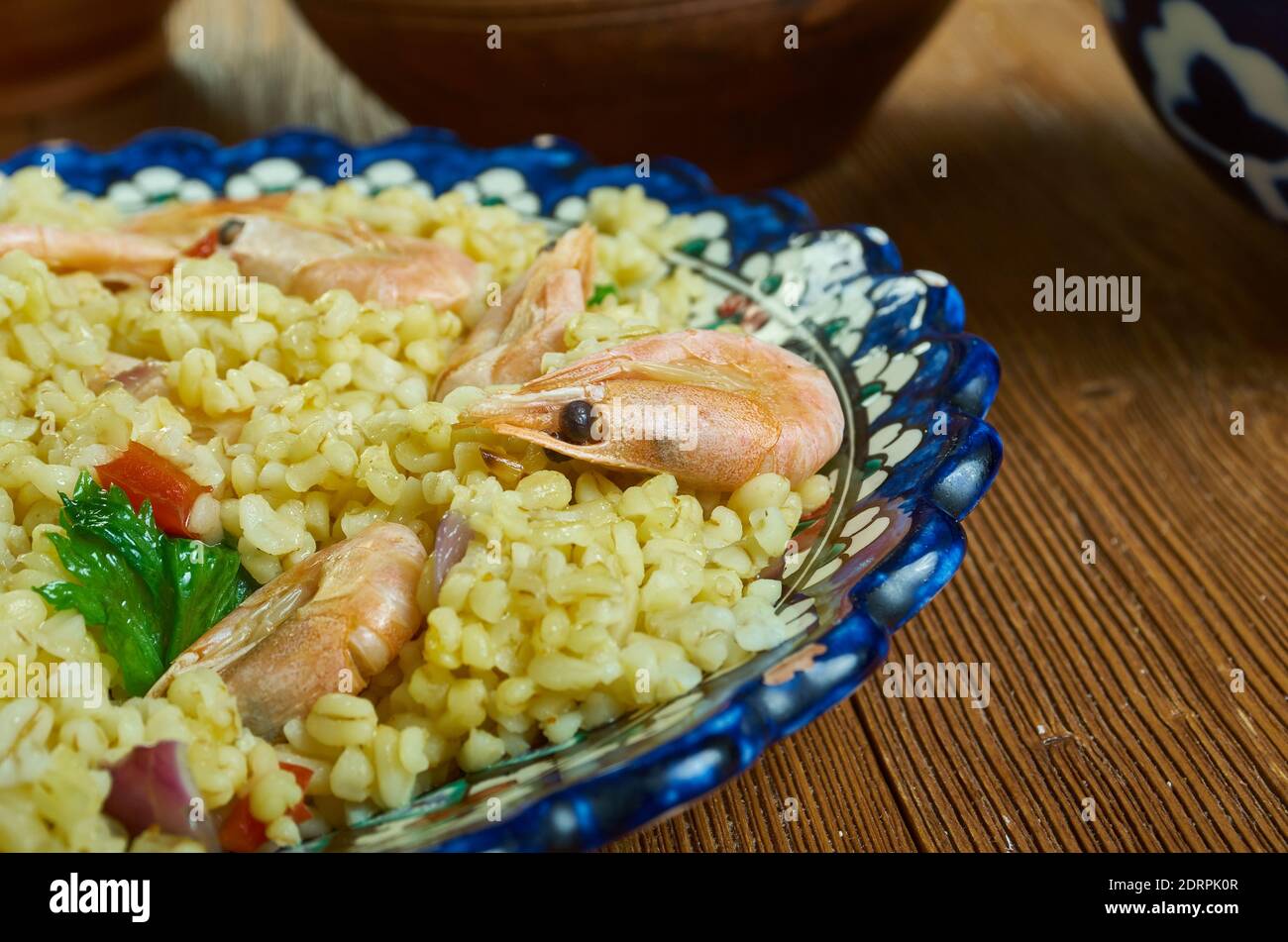 Bulgur di Pesce - Italienischer Bulgur mit Venusmuscheln Stockfoto