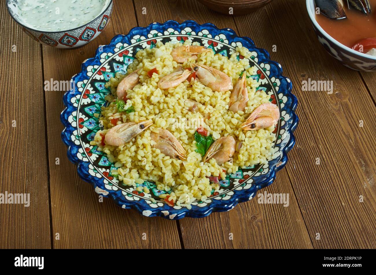 Bulgur di Pesce - Italienischer Bulgur mit Venusmuscheln Stockfoto