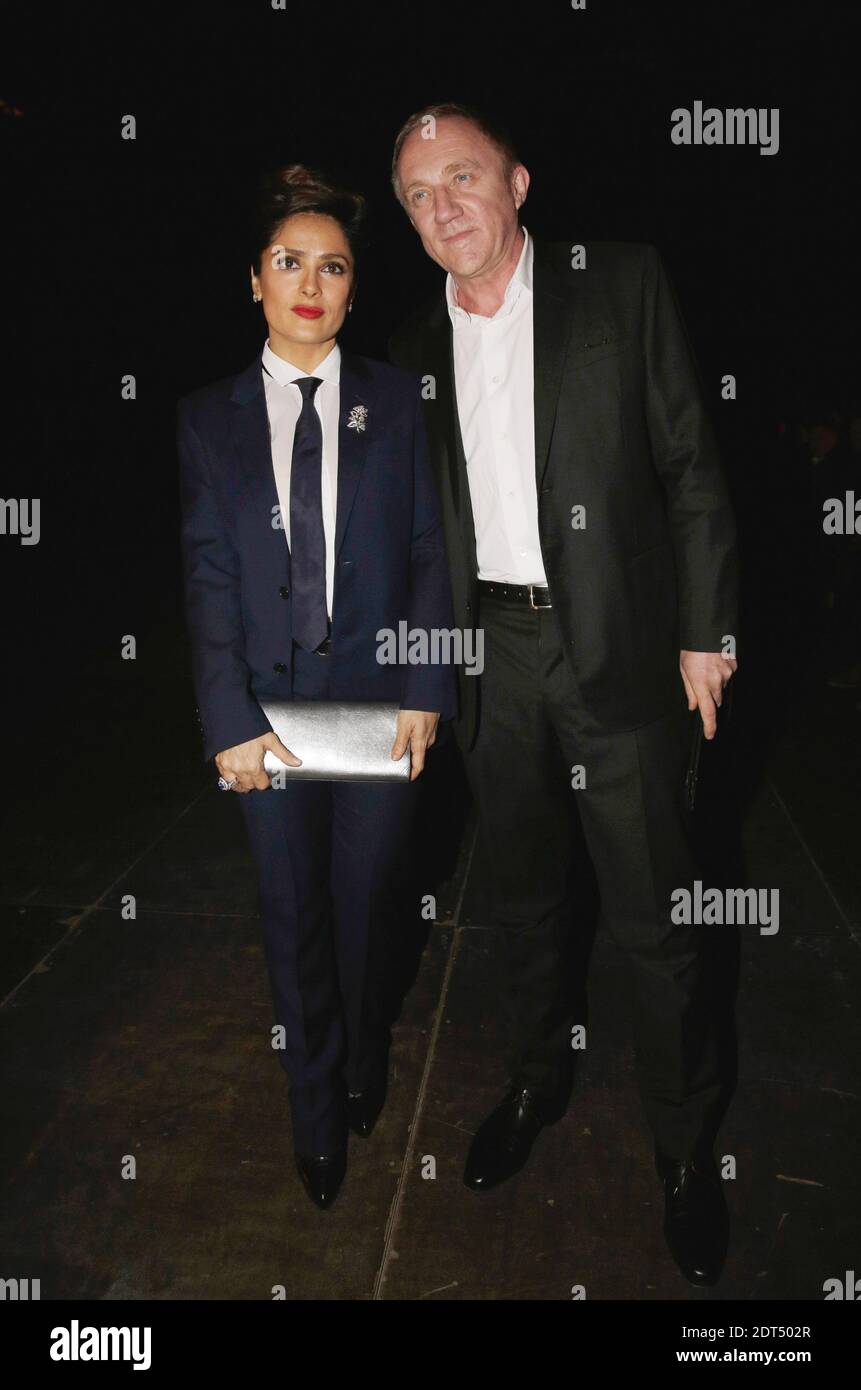 Salma Hayek und Francois-Henri Pinault erste Reihe bei Yves Saint-Laurents Herbst-Winter 2014/2015 Präsentation der Herrenkollektion, die am 19. Januar 2014 im Dome des Invalides in Paris, Frankreich, stattfand. Foto von Jerome Domine/ABACAPRESS.COM Stockfoto