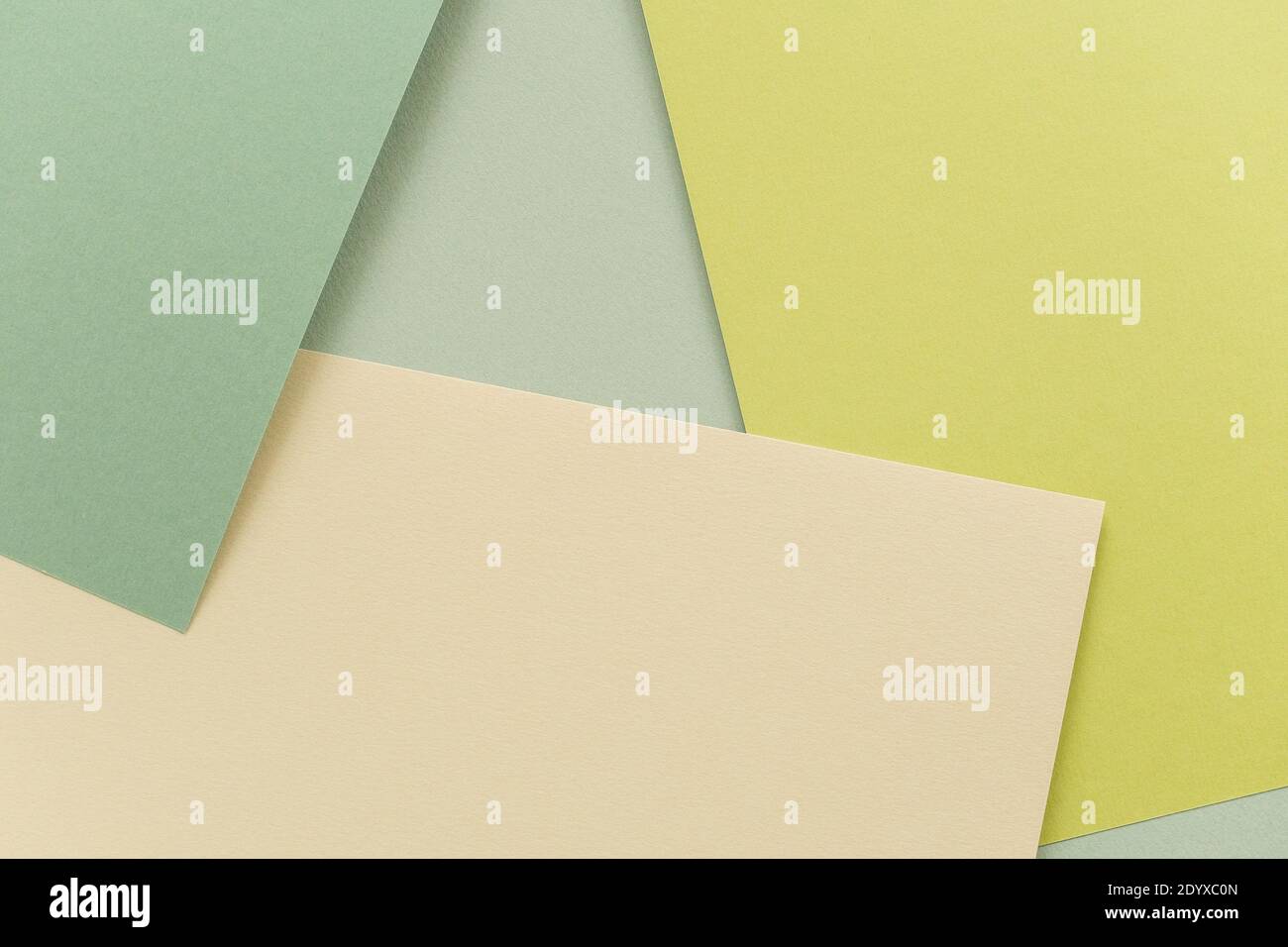 Geometrischer Papierhintergrund, Textur von Grüntönen. Hintergrund für Ihr Design. Pastellfarben im Frühling. Stockfoto