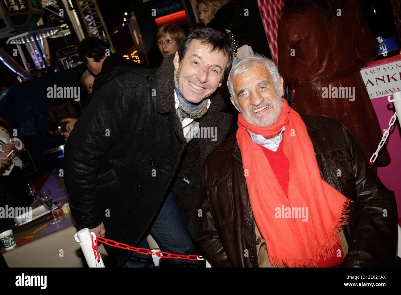 Jean-Luc Reichmann und Jean-Paul Belmondo nehmen an der Grand Palais Funfair Party Teil, die Marcel Campion am 19. Dezember 2013 in Paris veranstaltet hat. Foto von Jerome Domine/ABACAPRESS.COM Stockfoto