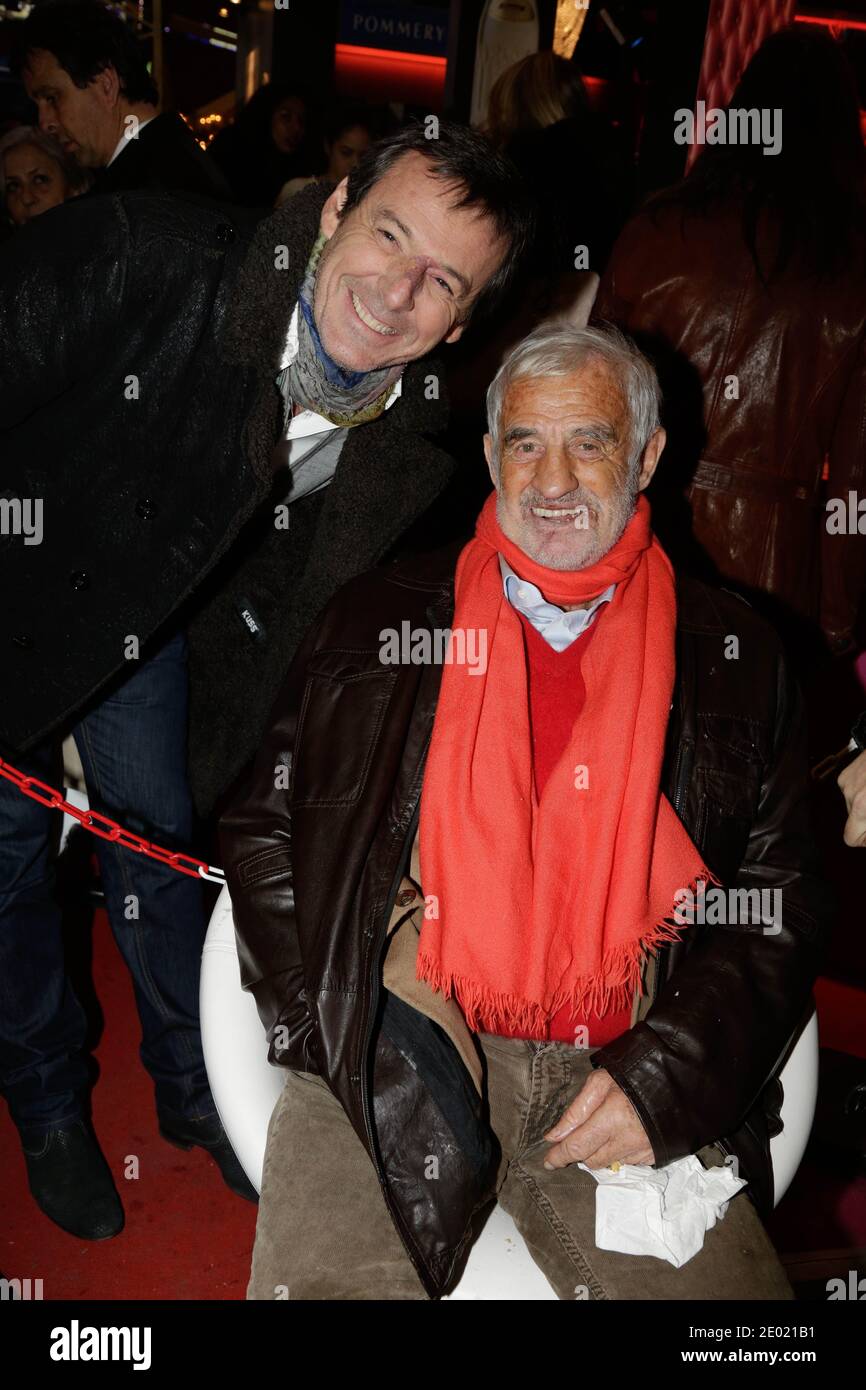 Jean-Luc Reichmann und Jean-Paul Belmondo nehmen an der Grand Palais Funfair Party Teil, die Marcel Campion am 19. Dezember 2013 in Paris veranstaltet hat. Foto von Jerome Domine/ABACAPRESS.COM Stockfoto