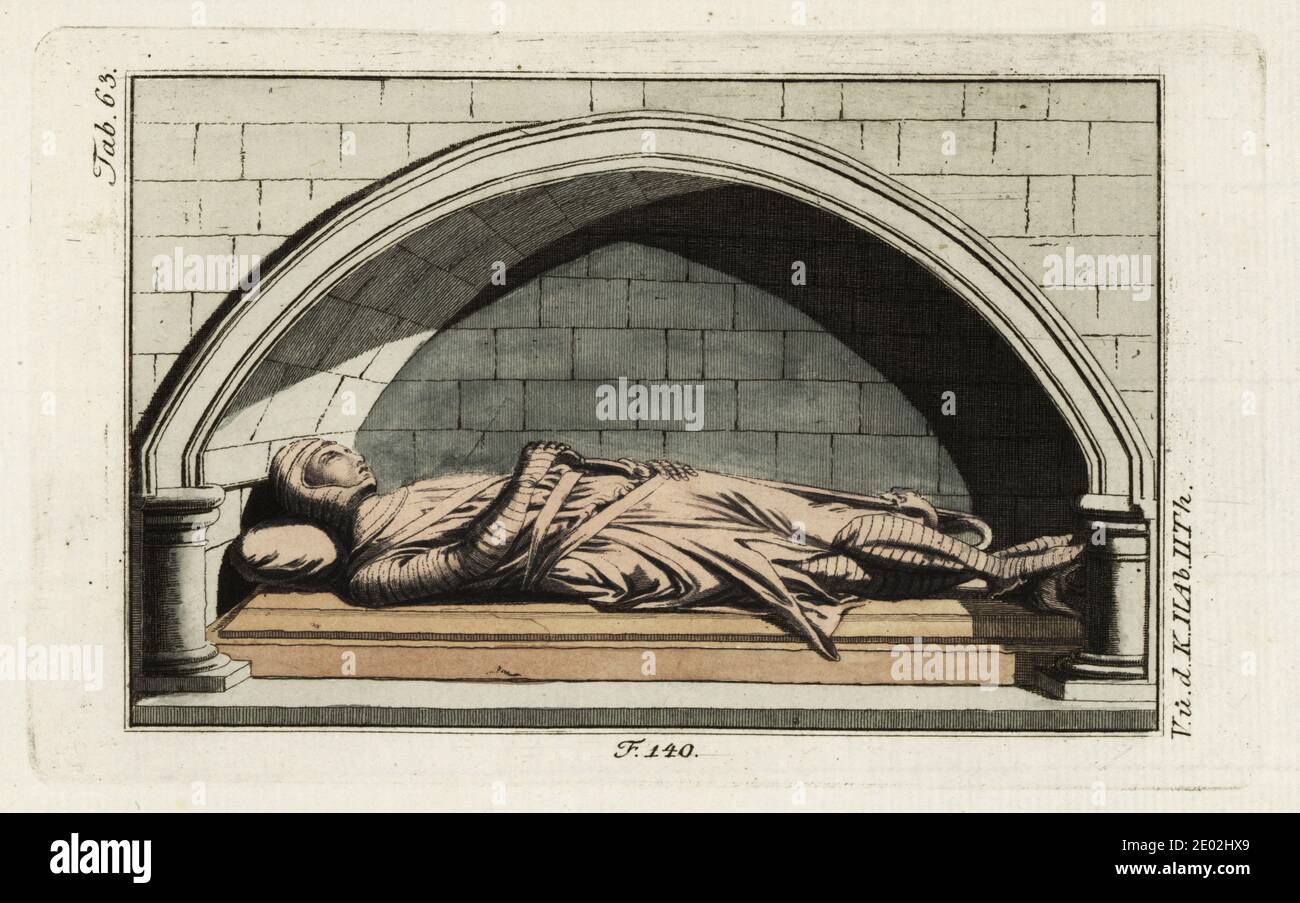 Bildnis eines normannischen Ritters in Rüstung aus der Danbury Kirche, 13. Jahrhundert. Geschnitztes hölzernes Denkmal eines Mannes in Anzug von Kettenpost-Rüstung von Koif, Hauberk und Schlauch, mit ärmellosem Mantel. Seine rechte Hand greift nach seinem Schwert. Möglicherweise ein Tempelritter der Familie Saint Clere oder Sinclair. Handkolorierter Kupferstich aus Robert von Spalarts historischem Bild der Kostüme der Hauptleute der Antike und des Mittelalters, Wien, 1802. Stockfoto