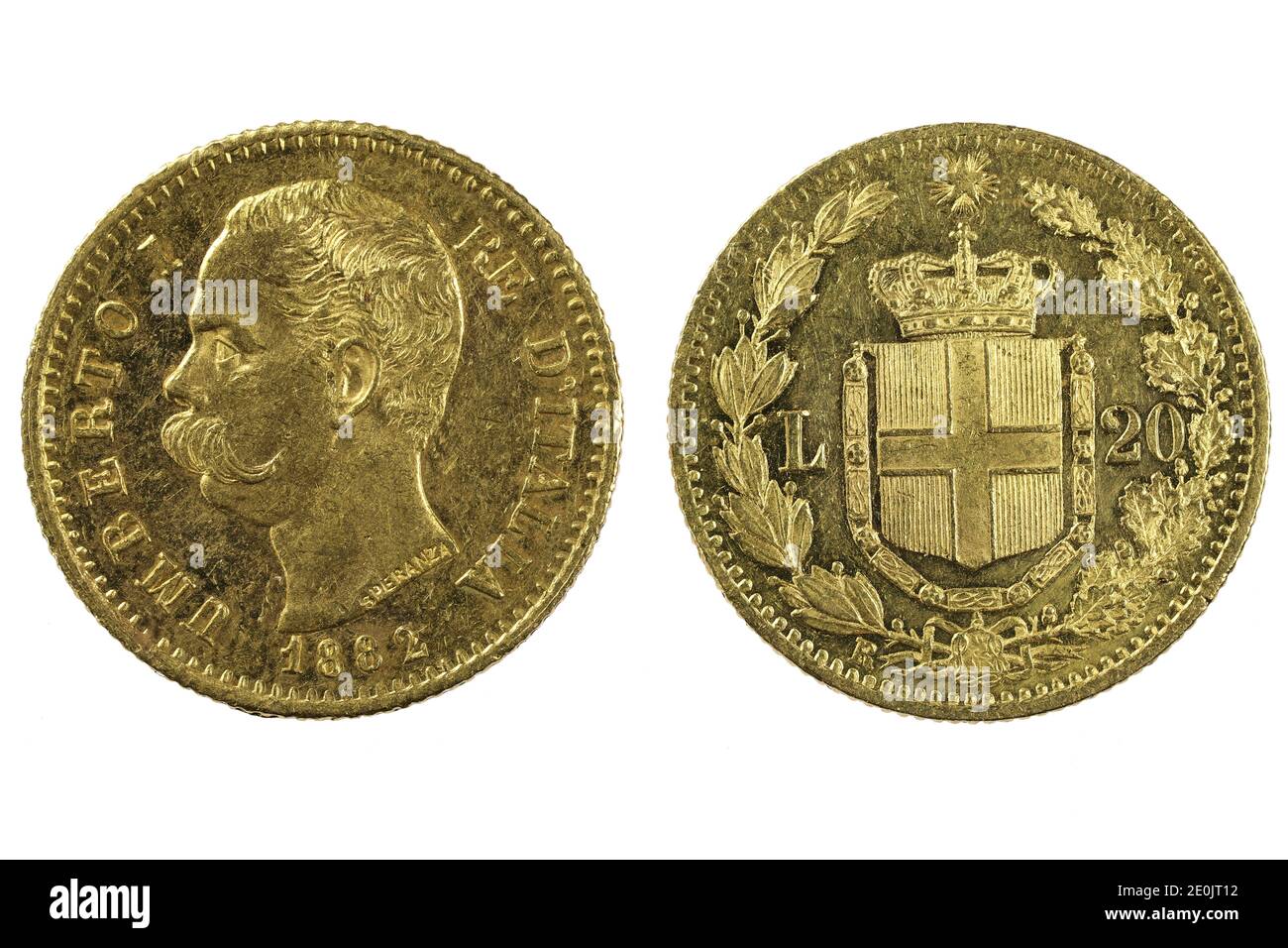 Italienische 20 Lira Goldmünzen isoliert auf weißem Hintergrund Stockfoto