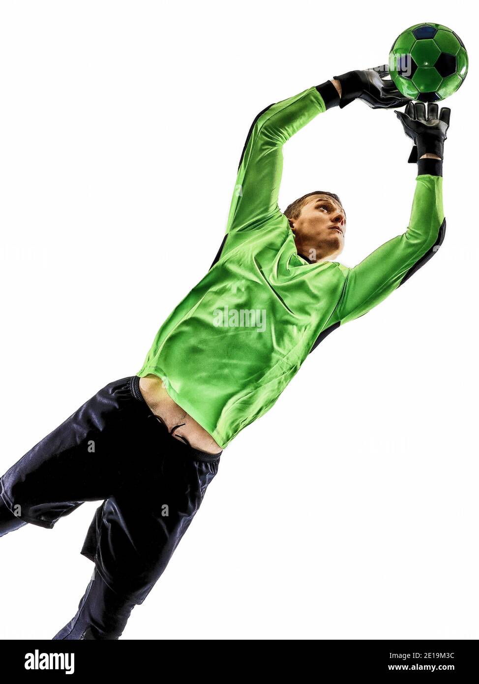 Ein kaukasischer Fußballtorhüter im Schatten der Silhouette im Studio, isoliert auf weißem Hintergrund Stockfoto