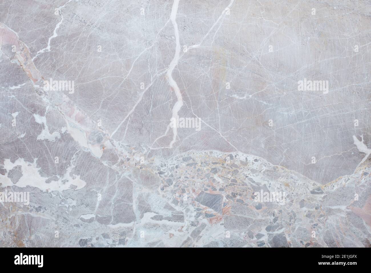 Grauer, vielbunter Stein-Textur-Hintergrund mit weißer Ader Stockfoto