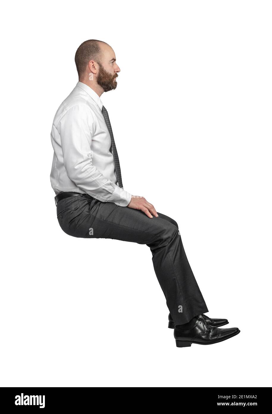 Geschäftsmann in Position sitzend Seitenansicht isoliert auf weiß. Stockfoto