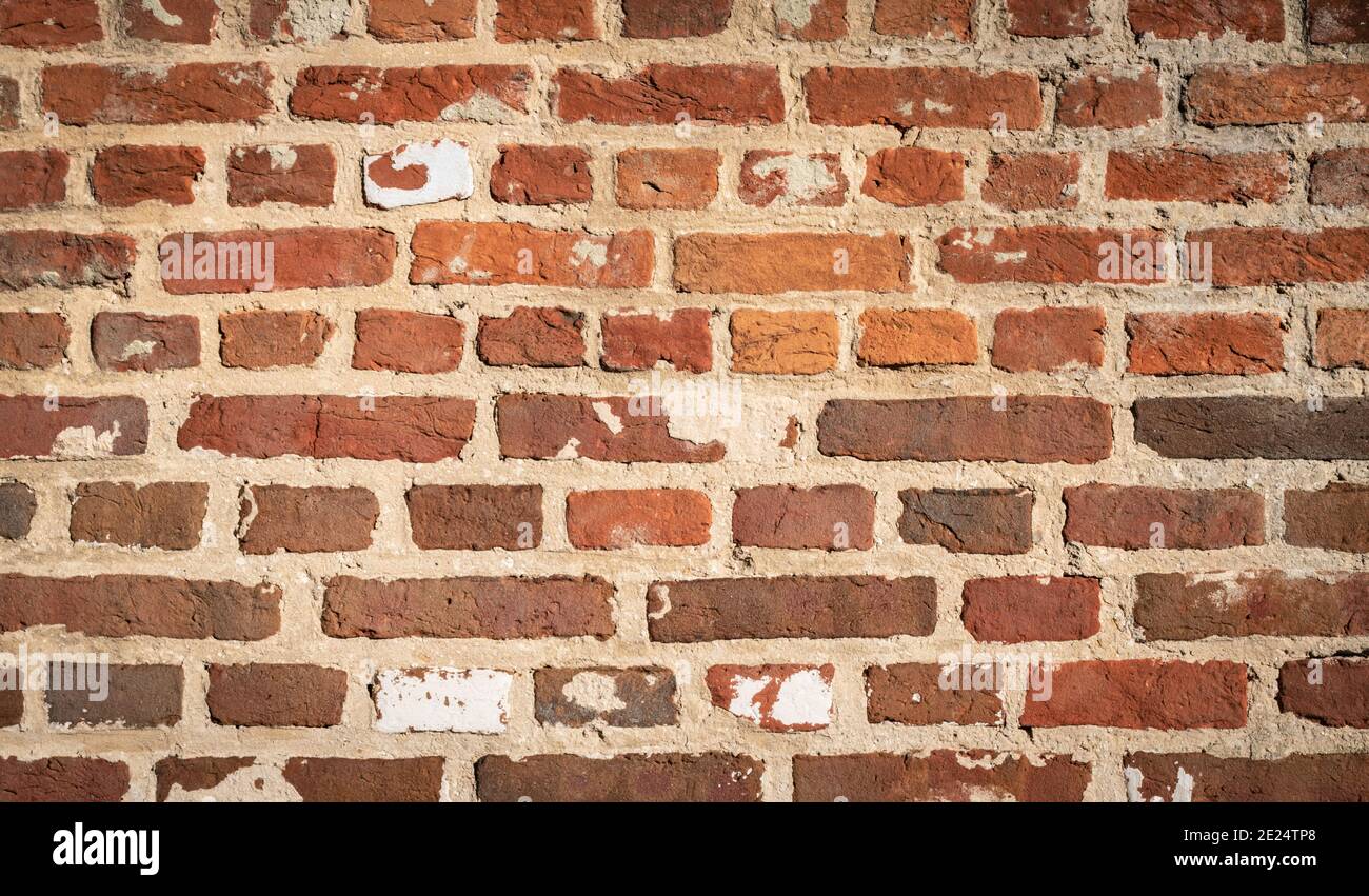 Alte Backsteinmauer Hintergrund. Rot-braune Steine. Stockfoto