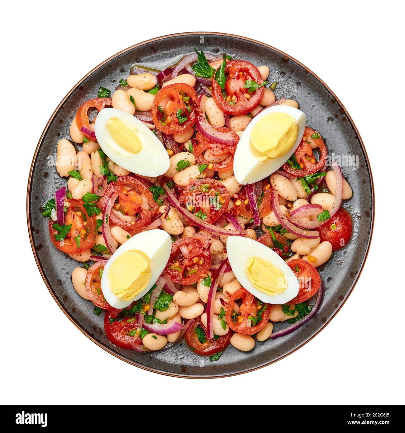 Ein Piyaz-Salat auf schwarzem Teller auf dunkler Schieferplatte. Türkische Küche vegetarisches Gericht. Speisen der mittelöstlichen Küche. Draufsicht Stockfoto