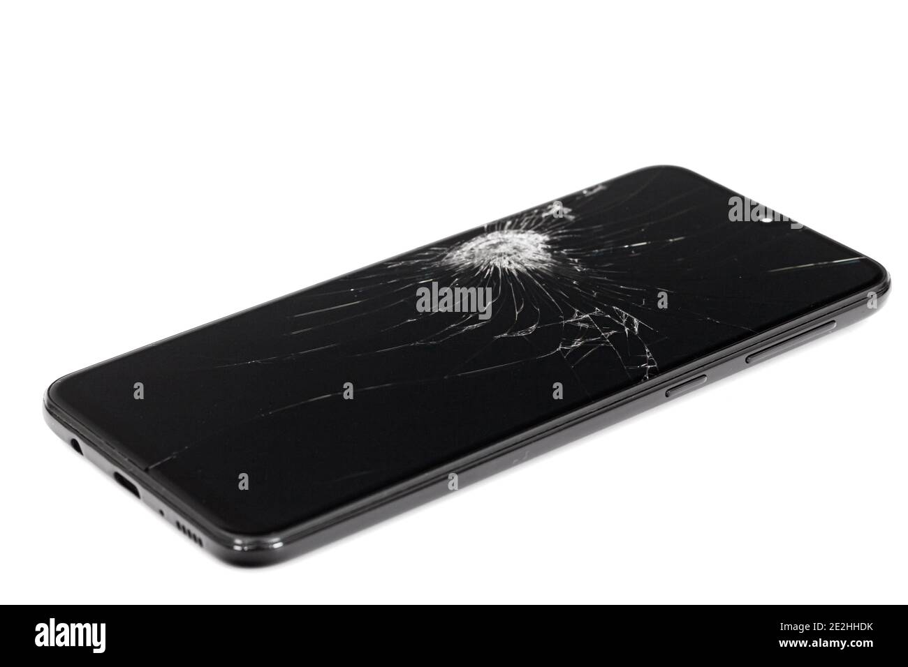 Smartphone mit kaputtem Display, isoliert auf weißem Hintergrund Stockfoto