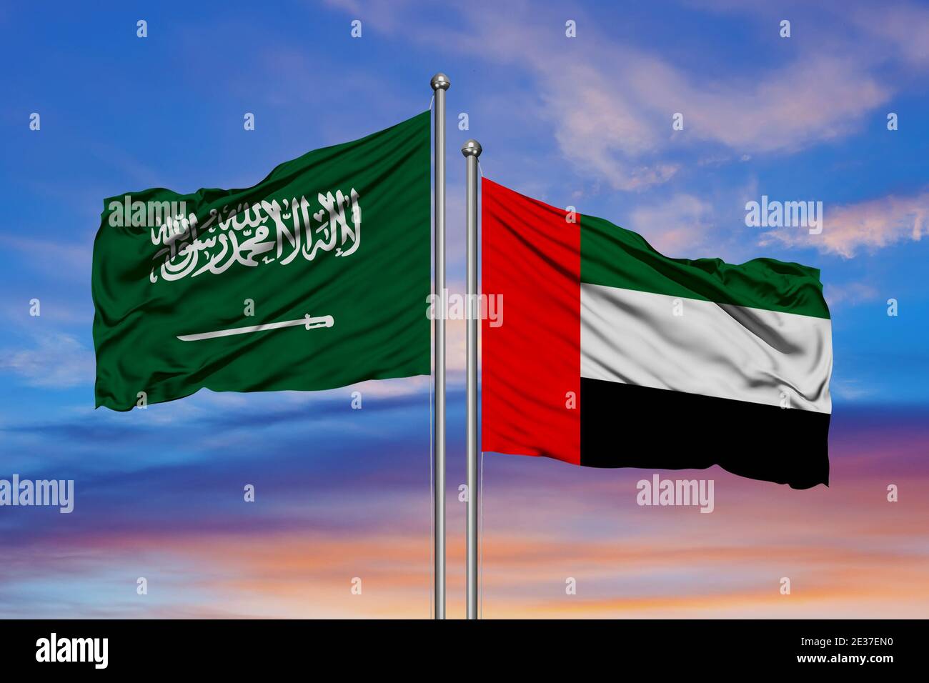 Saudi-Arabien und Vereinigte Arabische Emirate, zwei Fahnen winken gegen blauen Himmel. 3d-Bild Stockfoto